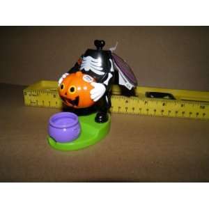  headless skeleton with pumpkin, candy dispenser 