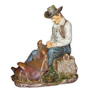 Cowboy Mending Saddle Figurine  