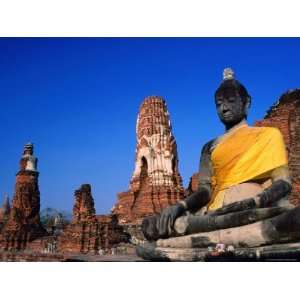 Buddha Statue in Yellow Silk with Ruins in Background Art Photographic 