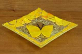   across. Bright yellow butterfly design with black accents