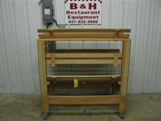 You are looking at a 48 wood bakery/bread display rack w/ 3 shelves.