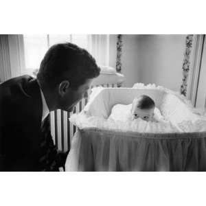  Sen. Jack Kennedy Admiring Baby Caroline as She Lies in 