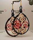   LARGE BLACK WIRE HOOP/SOFT GOLD AND PINK SCROLL DESIGN EARRINGS