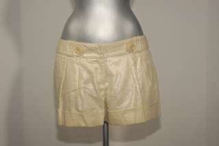 bebe gold Shorts size 4  