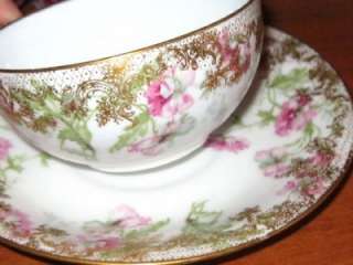 LIMOGES HAND PAINTED FLORAL HVY GOLD TEA CUP AND SAUCER  