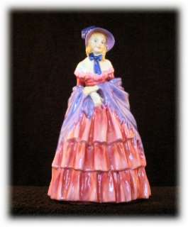 With purple bonnet and radiant blue feather decoration her matching 