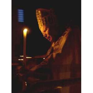 Pope John Paul II Prays Before a Candle at the Beginning of an Holy 