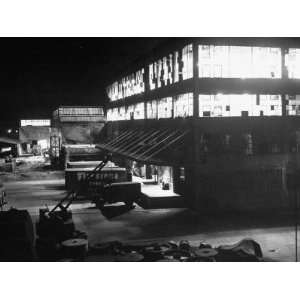 Exterior of Firestone Tire and Rubber Co. Plant at Night Photographic 