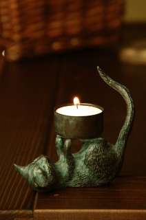This adorable cat sculpture is cast in brass with a verdi finish 