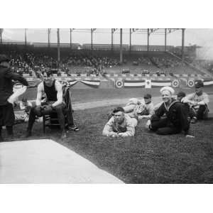 Joe Welling, boxer, amid Cleveland baseball players in stadium, 1918 