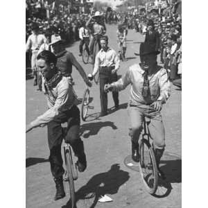  Men Riding Unicycles Through the Dodge City Parade 